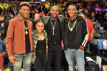 Floyd Mayweather attending a NBA match with daughter Iyanna Mayweather and two sons.
